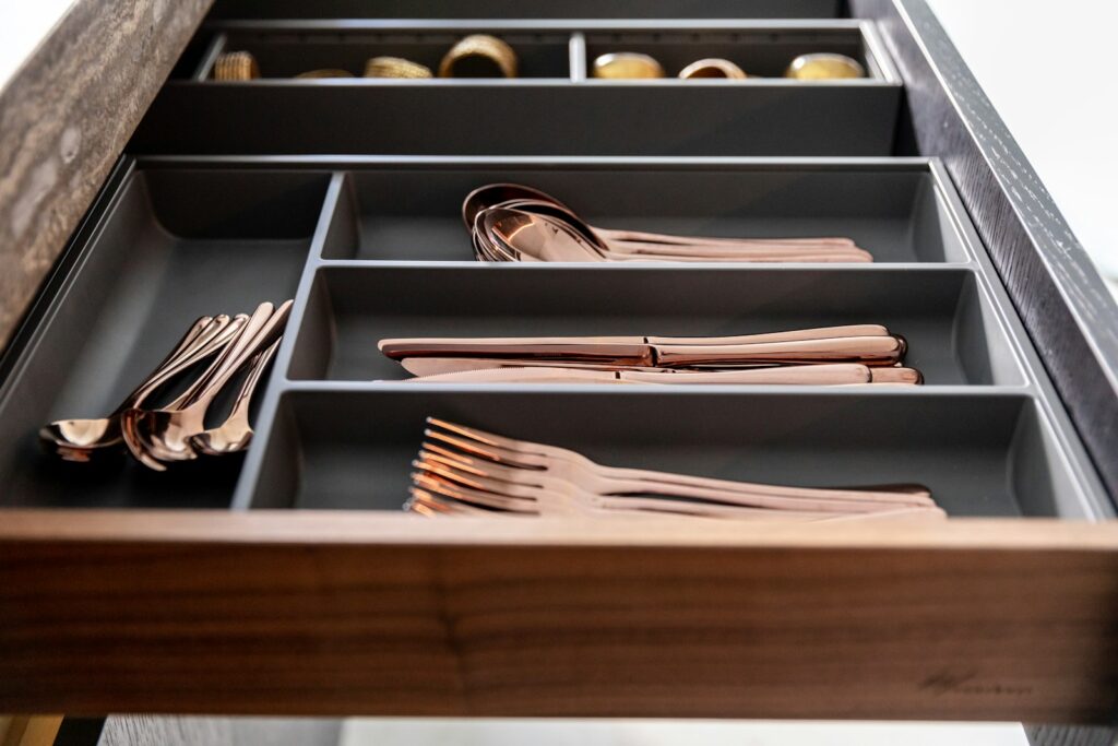 a drawer filled with lots of different types of utensils