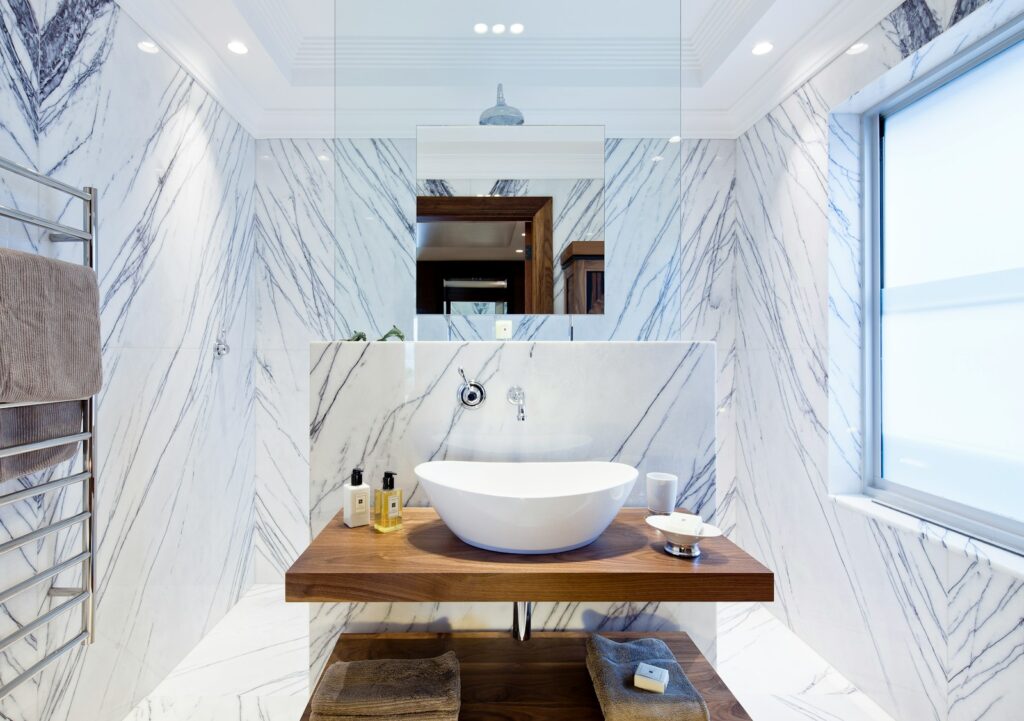 white ceramic sink on brown wooden table
