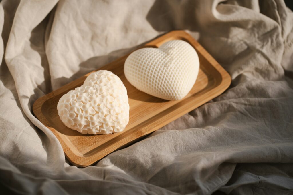 Two heart shaped cookies on a wooden tray